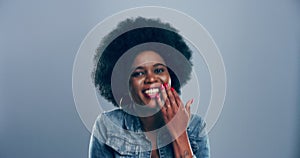 Comic, face and black woman laughing in a studio for funny or silly joke in humor with happiness. Smile, portrait and