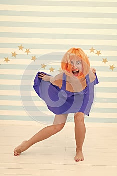 Comic and humorous concept. Woman playful mood having fun. Fun and entertainment. Girl bob wig posing striped background