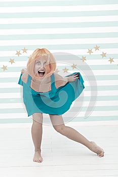 Comic and humorous concept. Woman playful mood having fun. Fun and entertainment. Girl bob wig posing striped background