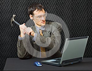 Comical person break computer with hammer