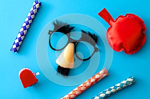 Comical prank, April fools practical joke and goofy disguise concept farting bag, chattering teeth, chinese finger trap and