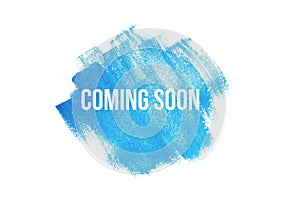 Coming soon on blue paint background, isolated on white. Advertising banner concept