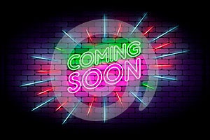 Coming soon with rays neon sign. Realistic neon effect on a brick wall. photo