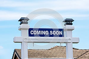 COMING SOON sign in front of a house for sale