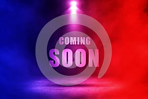 Coming soon text with red and blue spotlighting effect. photo