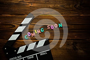 Coming soon text on the wooden background