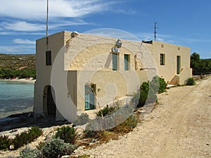 COMINO, MALTA - Apr 27, 2014: The Police Station, next to the sea at Santa Marija Bay, on the small island of Comino, Malta