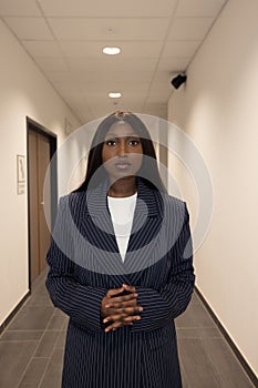 Commanding Presence: Young Black Woman in Pinstripe Blazer photo