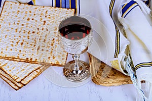 Commemorating passover with jewish pesach attributes, kosher wine, a matzah flatbread bread