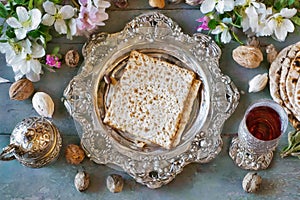 Commemorating passover with jewish pesach attributes, kosher wine, a matzah flatbread bread