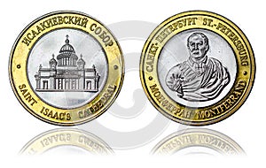 Commemorative coin with the image of St. Isaac`s Cathedral and a portrait of the architect Auguste Montferrand. St. Petersburg.