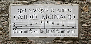 Commemorative sign of monk Guido Monaco, inventor of musical notation. Arezzo, Italy. Guido Monaco was born and lived here.
