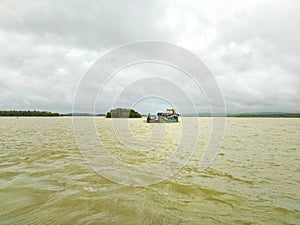 Commerce Afloat: Goods Boat Navigating the River's Flow