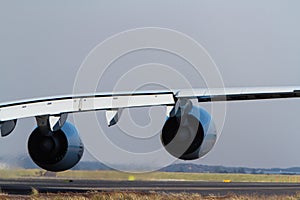 Commercial jet airliner wing with two engines photo