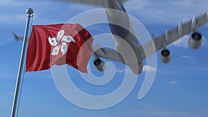 Commercial airplane flying above waving flag of Hong Kong. 3D rendering