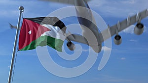 Commercial airplane flying above waving flag of Jordan. 3D rendering