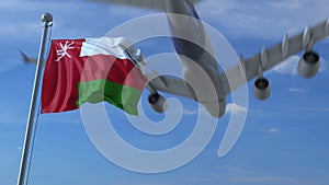 Commercial airplane flying above waving flag of Oman. 3D rendering
