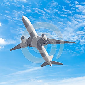 Commercial airplane flying with blue sky background with clip