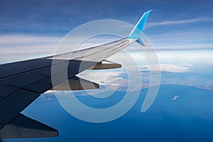 Commercial airplane flying over the Crete island - Greece