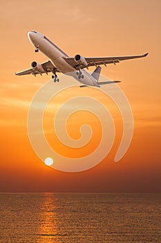 Commercial airplane flying over the sea