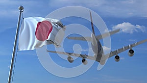 Commercial airplane landing behind waving Japanese flag. Travel to Japan conceptual 3D rendering