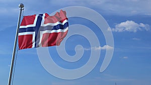 Commercial airplane landing behind waving Norwegian flag