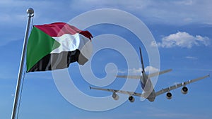 Commercial airplane landing behind waving Sudanese flag. Travel to Sudan conceptual 3D rendering