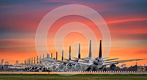 Commercial airplane parking at the airport are stopped effect by covid-19 pandemic around the world economic down crisis, photo