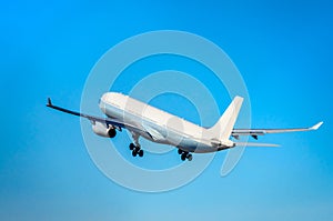 Commercial airplane taking off into the blue sky