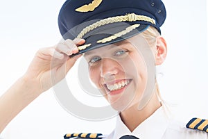 Commercial captain pilot in uniform smiling. Aviation