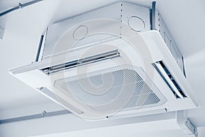 Commercial Ceiling Cassette Air Conditioners setup in office without ceiling sheet blue clean colortone