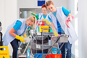 Commercial cleaners doing the job together