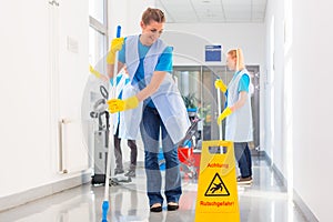 Commercial cleaning brigade working photo