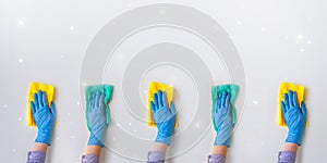 Commercial cleaning company. Employee hands in blue rubber protective glove. General or regular cleanup
