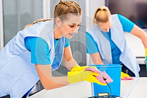 Cleaning ladies working in office