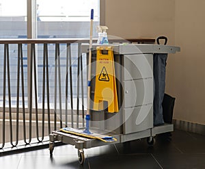 Commercial cleaning equipment with tools cart