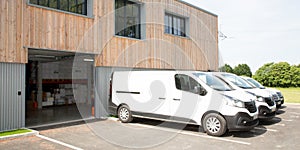 Commercial delivery vans in parking of transporting carrier shipping company