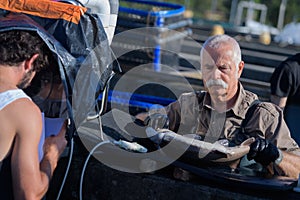 Commercial fisherman holding fish