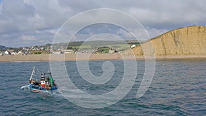 Commercial Fishing Vessel Heading out to Sea in the UK