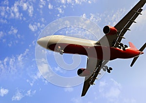 Commercial flight airplane flying on blue sky in travel tourism concept