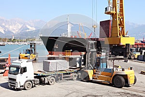 Commercial harbor with truck forklift and ship