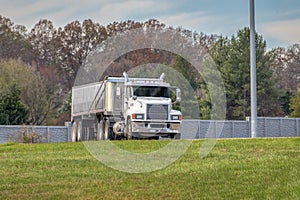 Commercial Heavy Dump Truck Exits Freeway