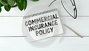 Commercial insurance policy- text label in the contract document on the planning folder. Transfer of risk in business by