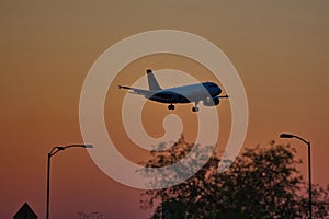 Commercial Jet on approach for Landing at Dusk