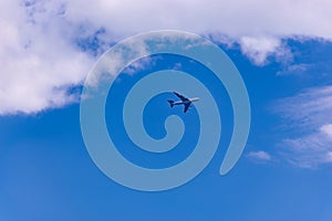 Commercial plane flight on blue sky