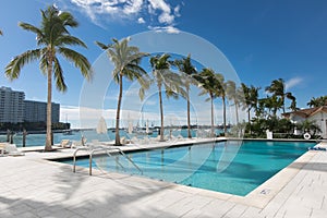 Commercial resort pool overlooking ocean and marina Miami