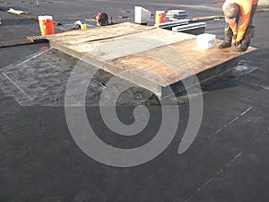 Commercial roofing repairs in progress on EPDM roof