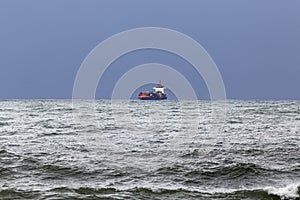 Commercial ship on the horizon