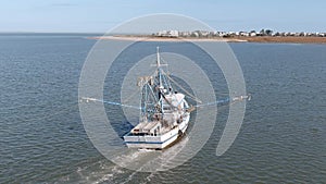 A commercial shrimping boat pulls nets off the cost of South Carolina