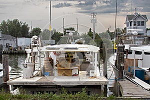 Commerical working fishing, crabbing and oystering boat in a marina on Tilghman Island on a stormy afternoon in the summer. photo